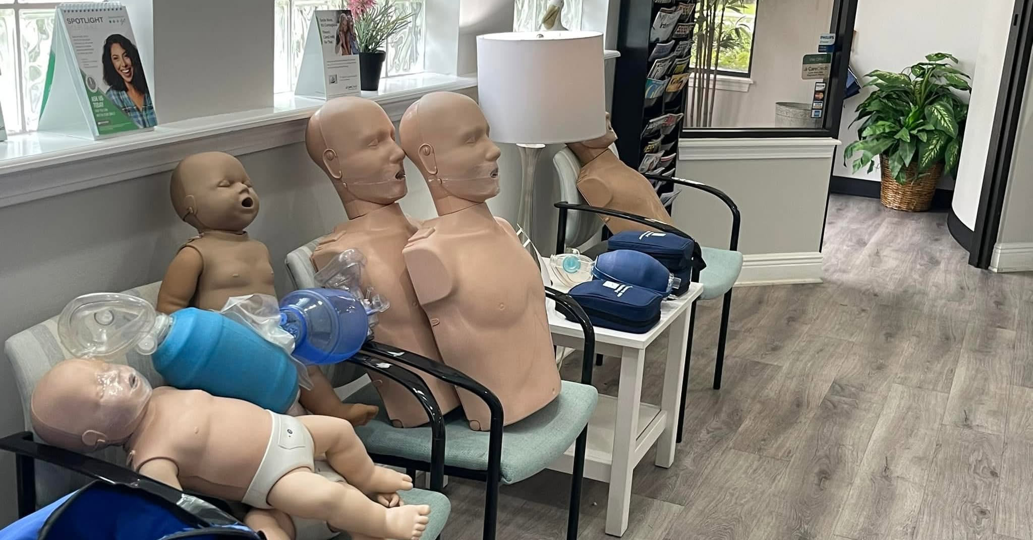 Adult, child and infant CPR training manikins with breathing bags, ready for class
